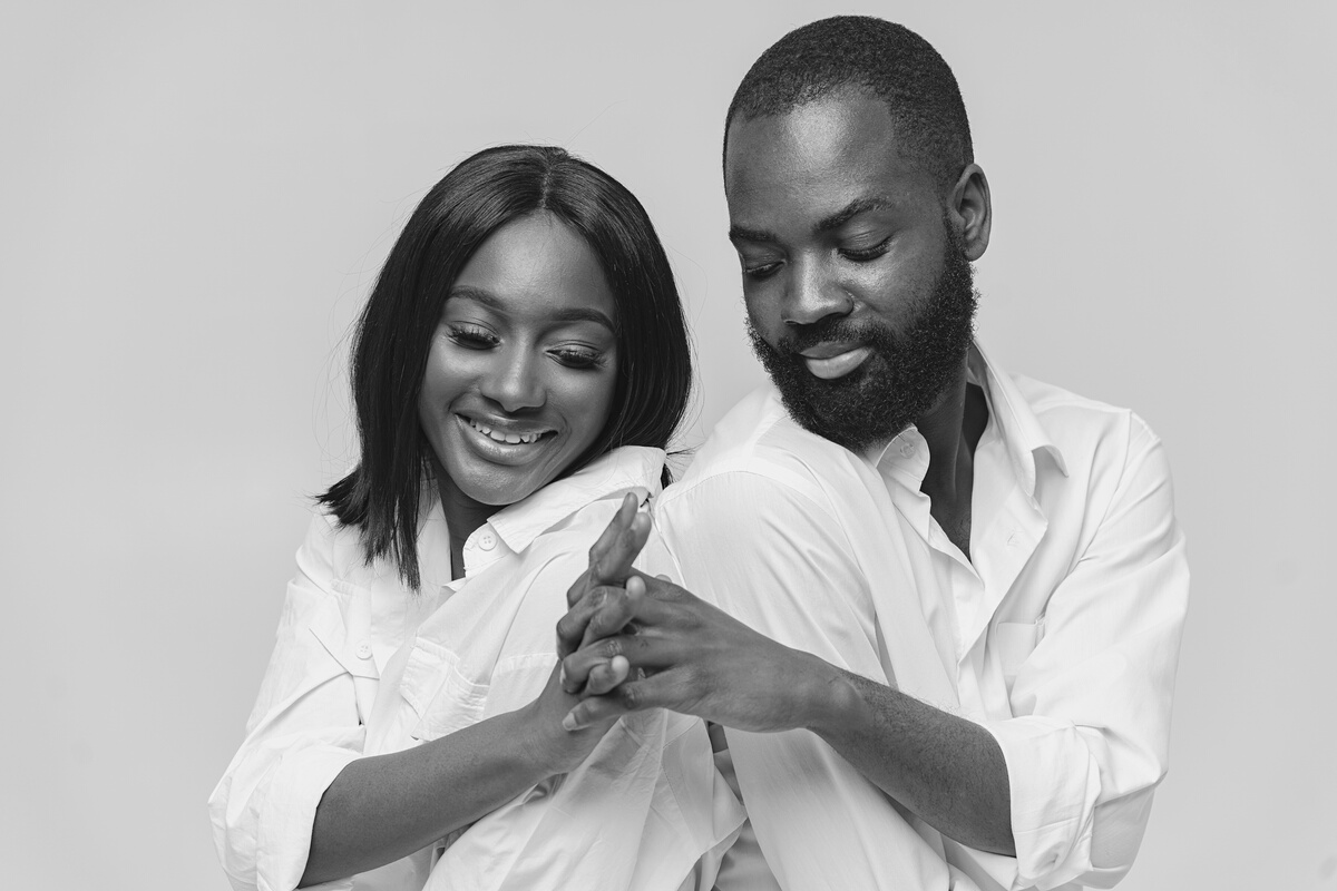 Black and White Photo of Couple Holding Hands