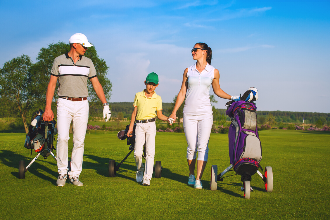 Family playing golf